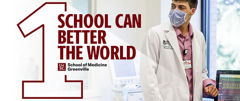 在模拟实验室里穿白大褂的男医学生。一个学校可以更好的世界标志。